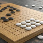 Split image showing close-ups of a Korean Baduk (Go) board with stones and a Janggi (Korean Chess) b...