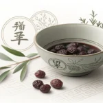 A bowl of traditional Korean herbal medicine (Hanyak) with dried herbs and an acupuncture needle, sy...