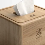 Close-up of a wooden napkin dispenser on a table in a Korean restaurant setting, symbolizing service...