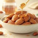 Close-up of Korean honey butter almonds in a ceramic bowl, representing the Korean learning topic of...
